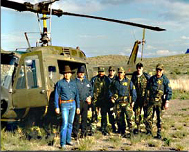 FBI agent Mat Perez (far left) led the American contingent of the assault team that raided Pablo Acosta's final hideout. Here he poses with other FBI agent in front of the U.S. Army helicopter that was used in the operation. 